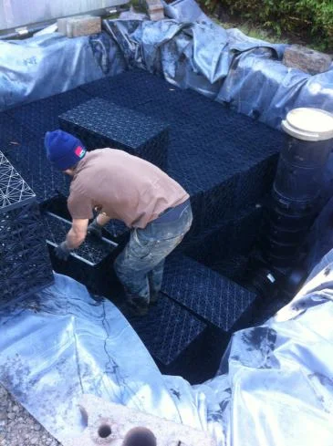 Installing the modular storage basin.