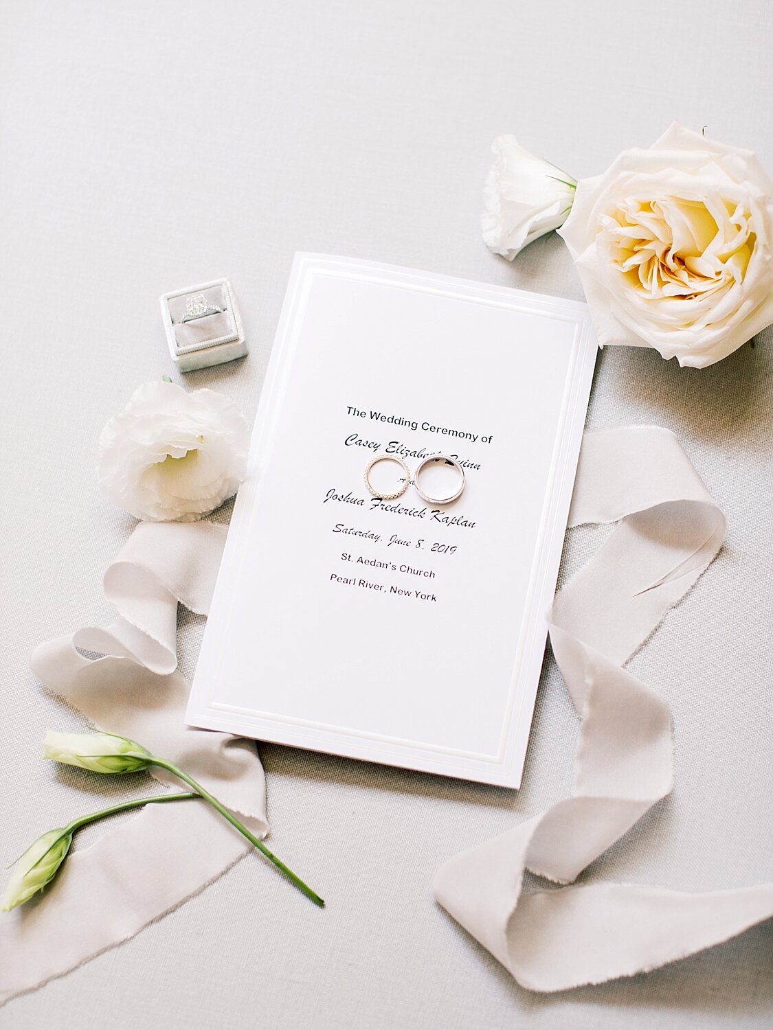 wedding stationery with wedding rings photographed by Asher Gardner Photography