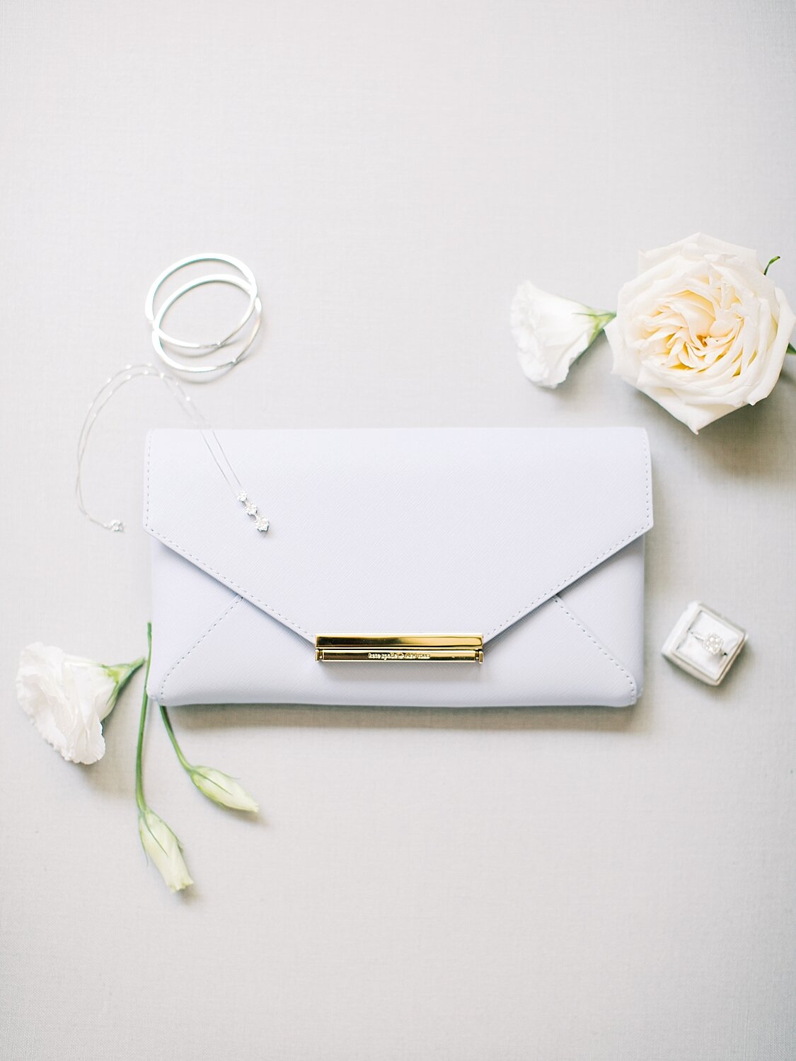 bride's clutch and details for New York wedding