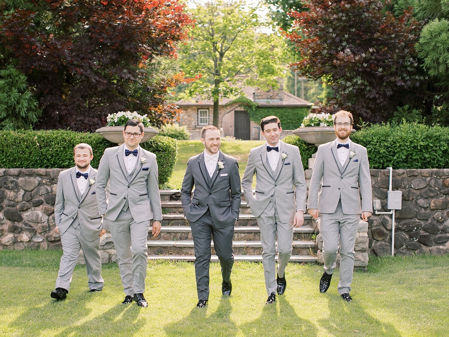 groomsmen in grey suits photographed by Asher Gardner Photography