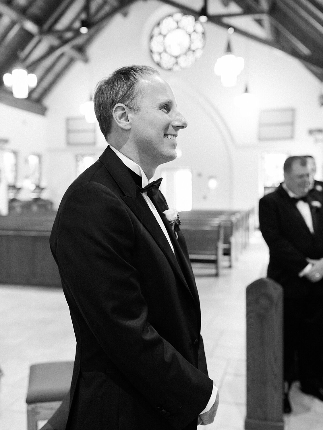 groom watches bride enter church photographed by Asher Gardner Photography