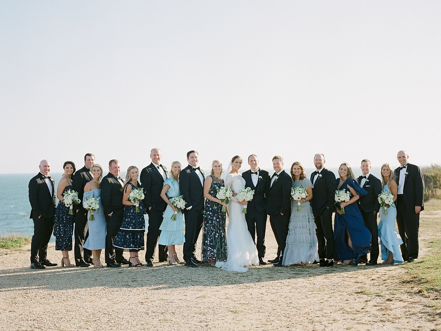 bridal party poses on Montauk beach with Asher Gardner Photography