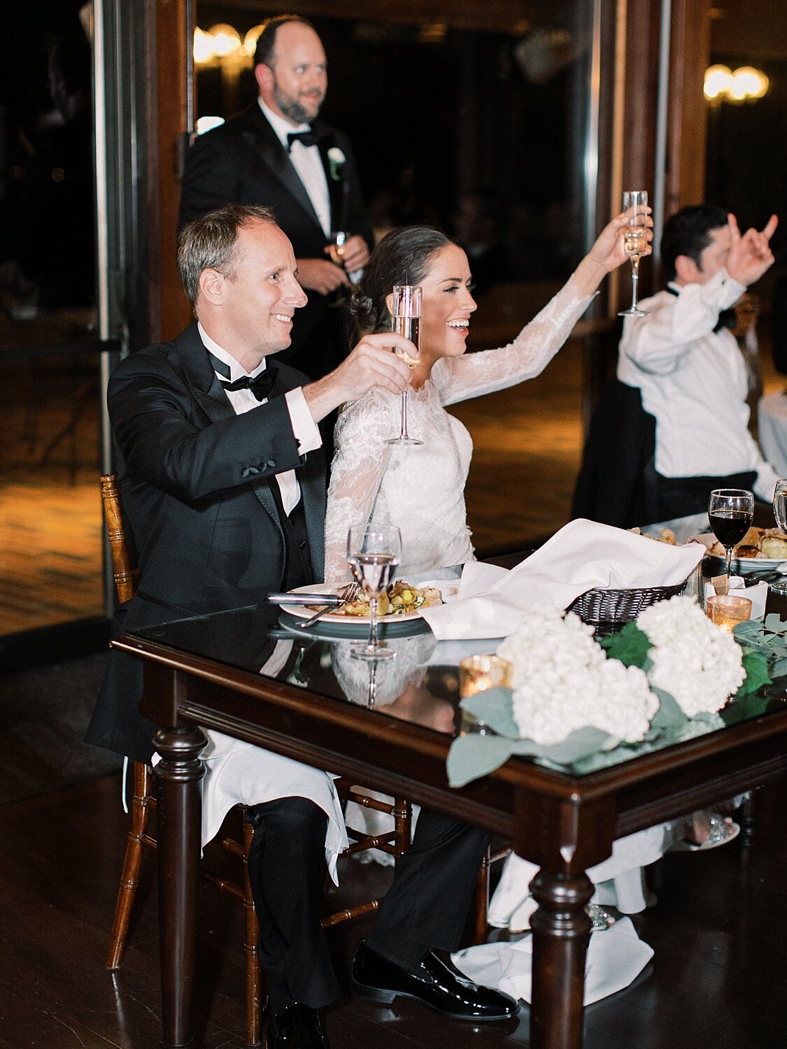 bride and groom toast during wedding reception by Asher Gardner Photography
