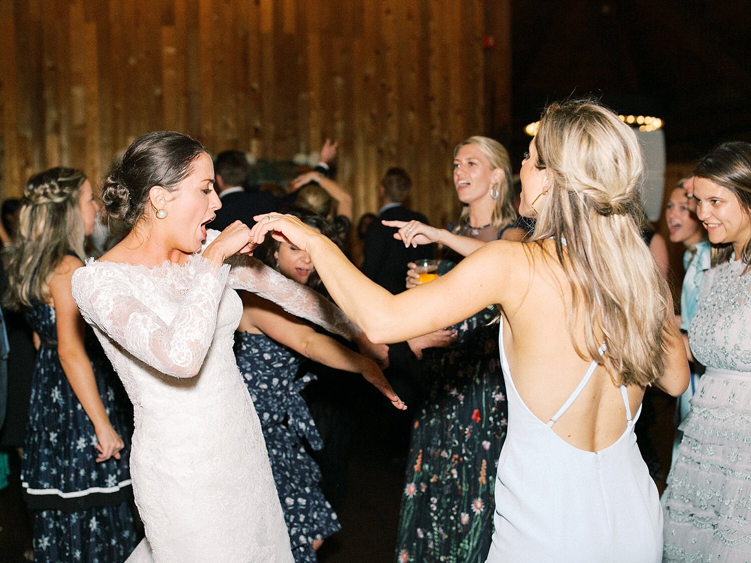 bridesmaids dance with bride at 360 Downs by Asher Gardner Photography