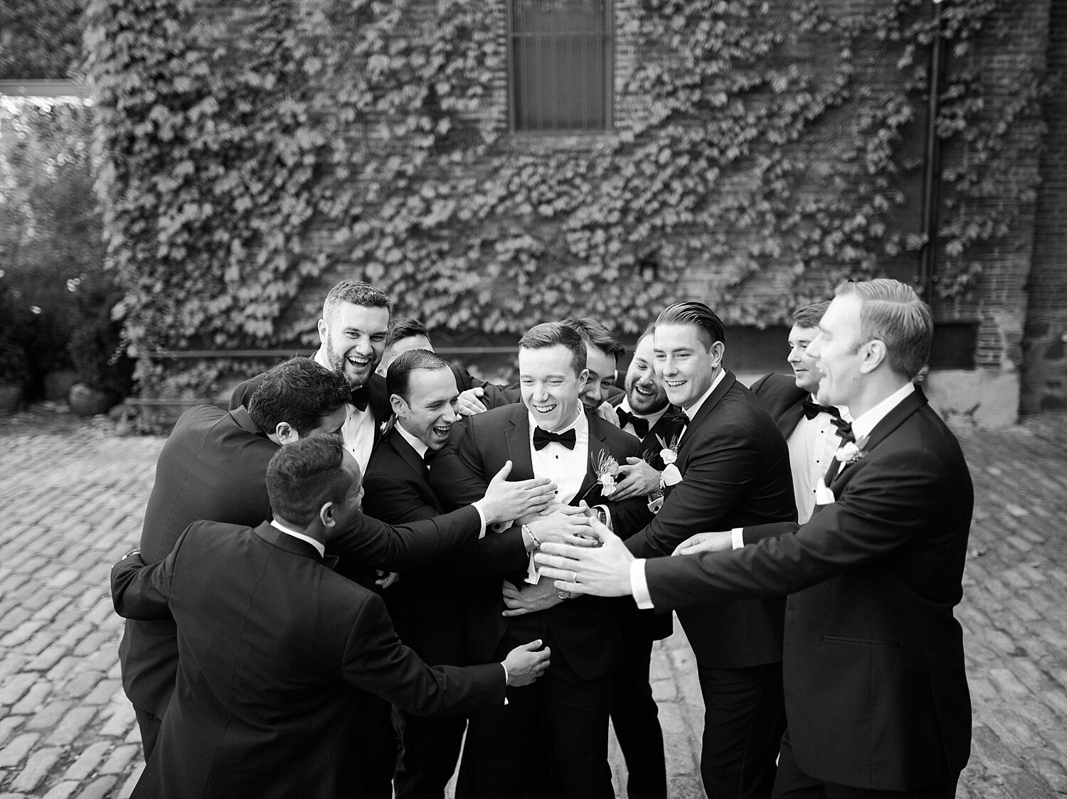 groomsmen tease groom on wedding day photographed by Asher Gardner Photography