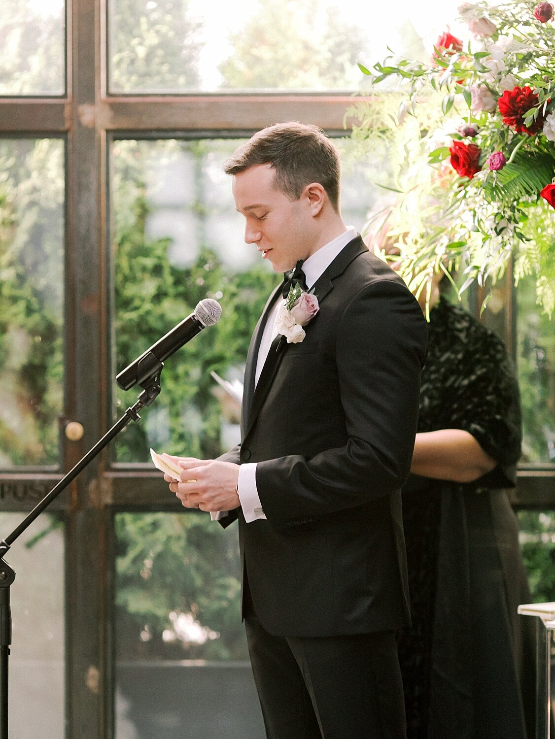 groom reads vows during wedding ceremony photographed by Asher Gardner Photography