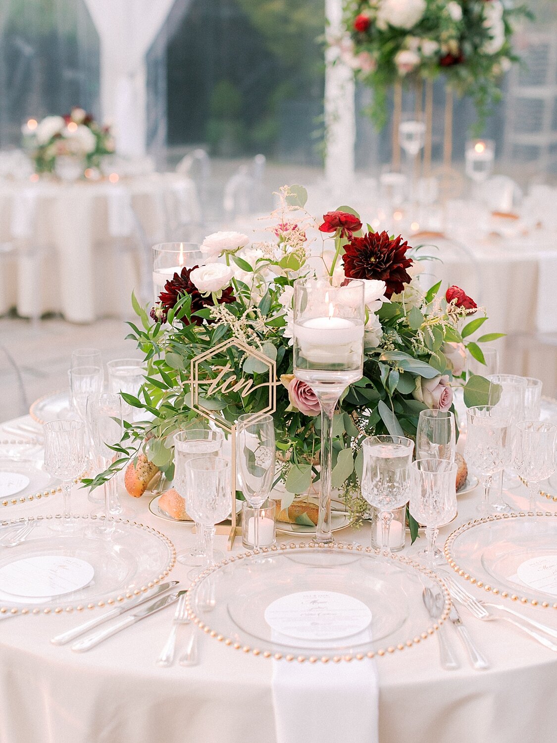 burgundy and ivory floral centerpieces with gold accents for Foundry wedding day
