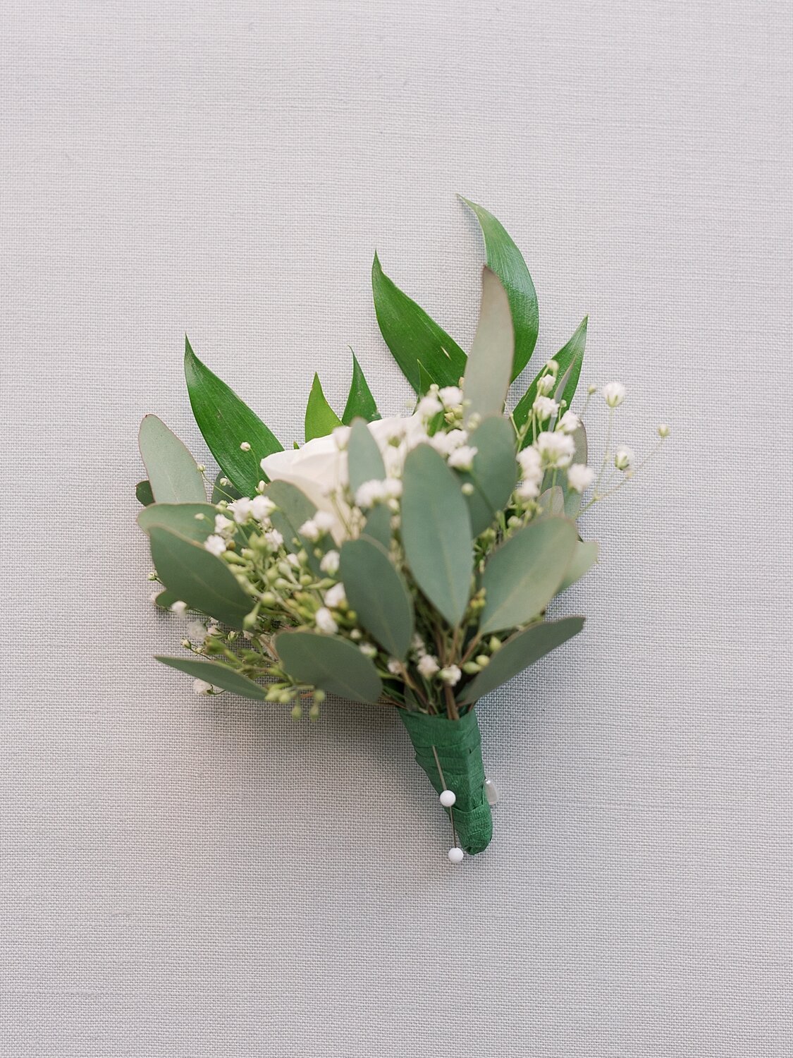 groom's boutonnière photographed by Asher Gardner Photography