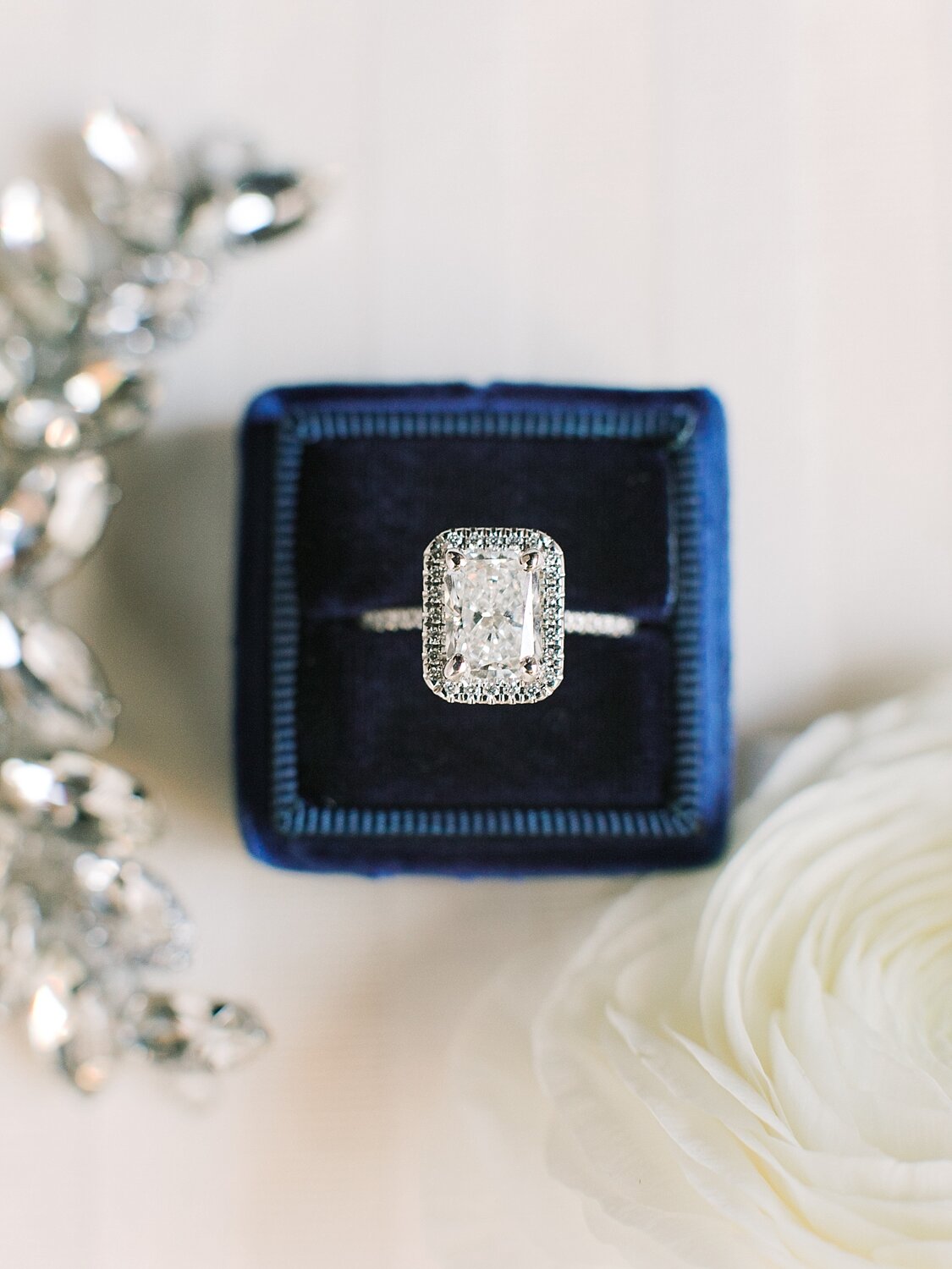 ring in navy blue box photographed by Asher Gardner Photography