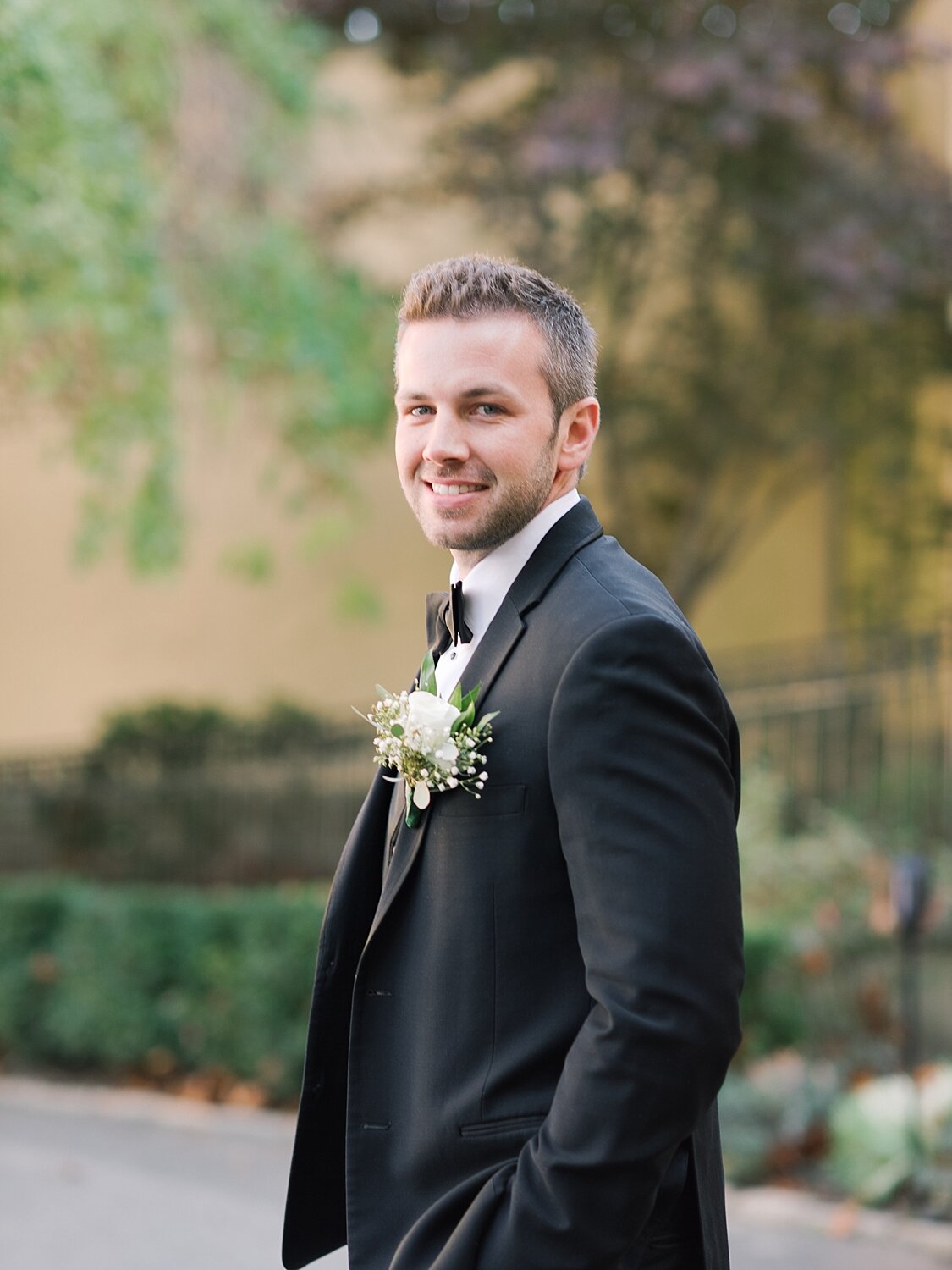 groom prepares for first look with Asher Gardner Photography