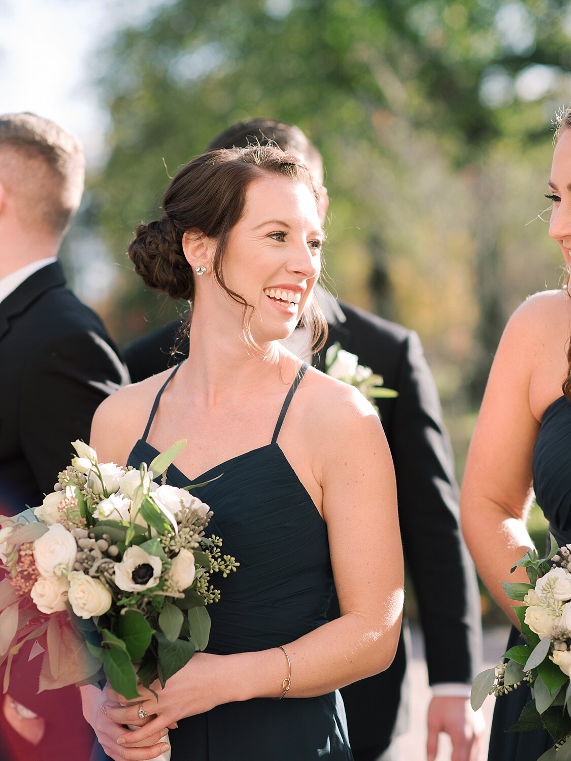 bridesmaids with florals pose for Asher Gardner Photography