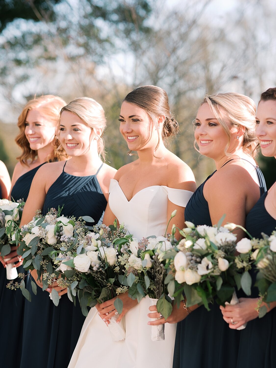 bridesmaids in green pose for Asher Gardner Photography