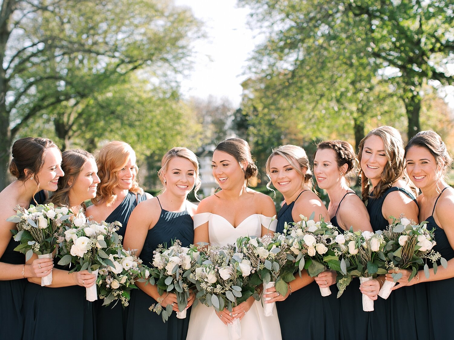bridesmaids pose with bride at the Mansion at Oyster Bay with Asher Gardner Photography