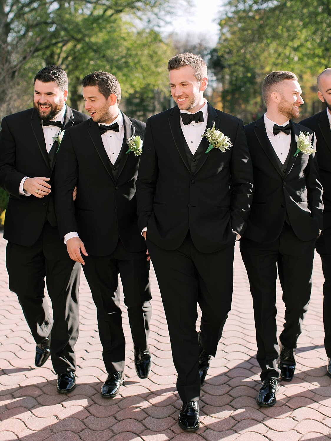 groom and groomsmen pose for Asher Gardner Photography