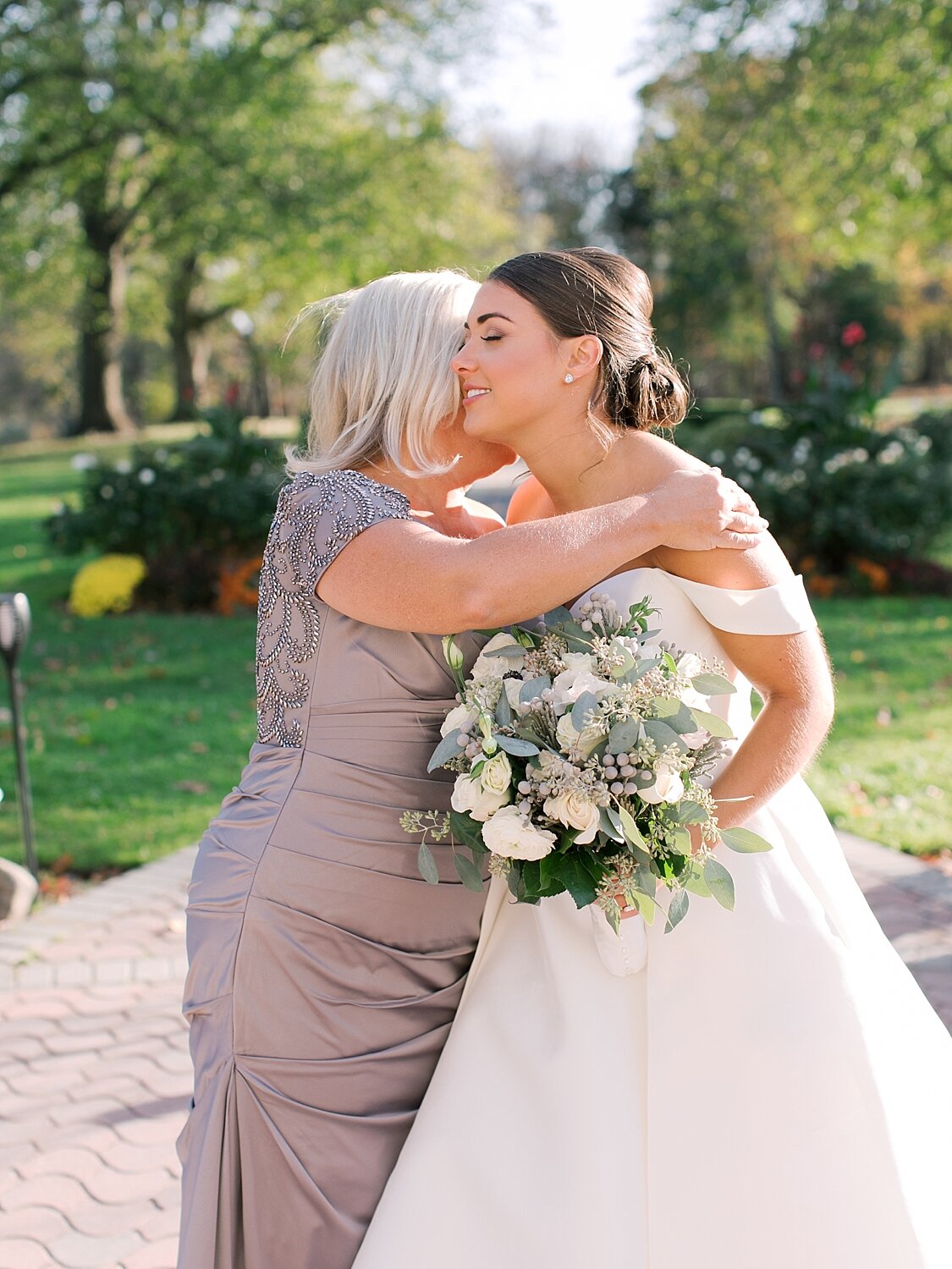 bride and mom embrace before wedding with Asher Gardner Photography