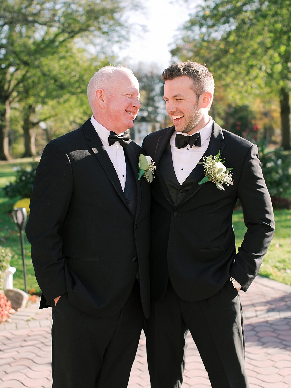 groom and father laugh with Asher Gardner Photography