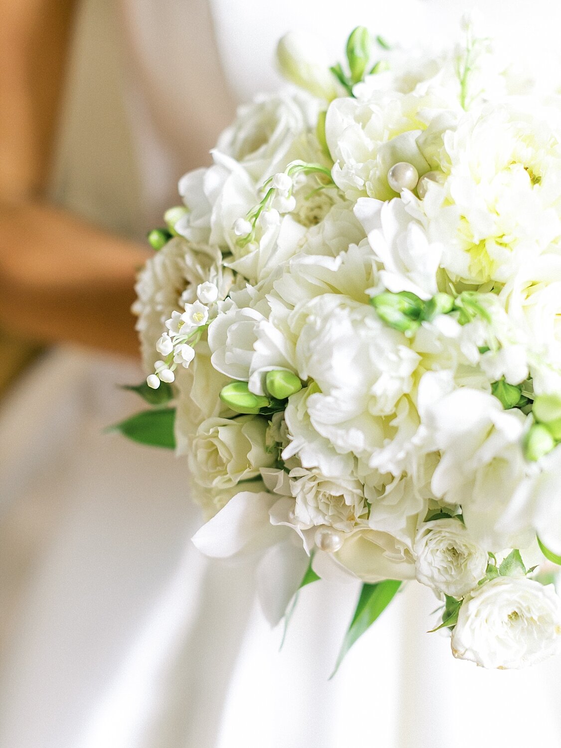 all white wedding bouquet photographed by Asher Gardner Photography