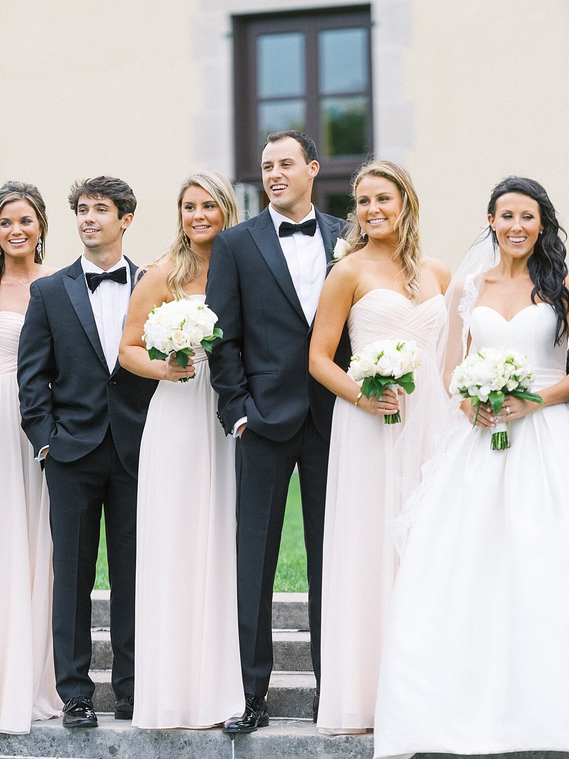 bridal party poses at Oheka Castle with Asher Gardner Photography