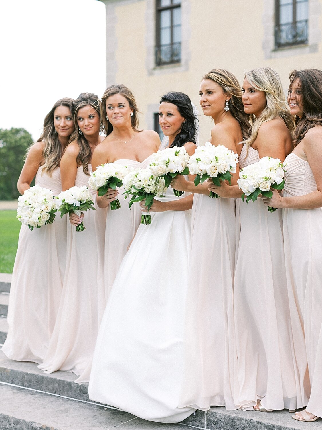 bridesmaids in pale pink gowns pose for Asher Gardner Photography