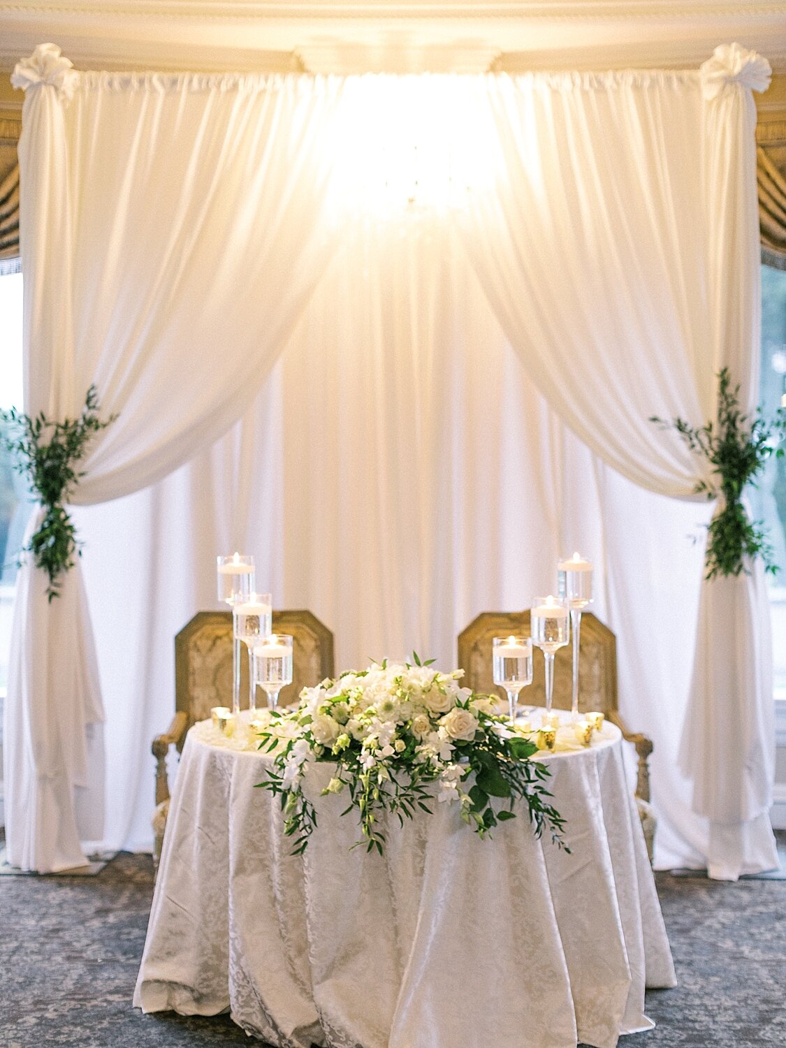wedding reception with all white florals at Oheka Castle photographed by Asher Gardner Photography