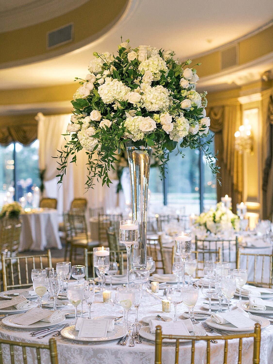 wedding reception with all white florals at Oheka Castle photographed by Asher Gardner Photography