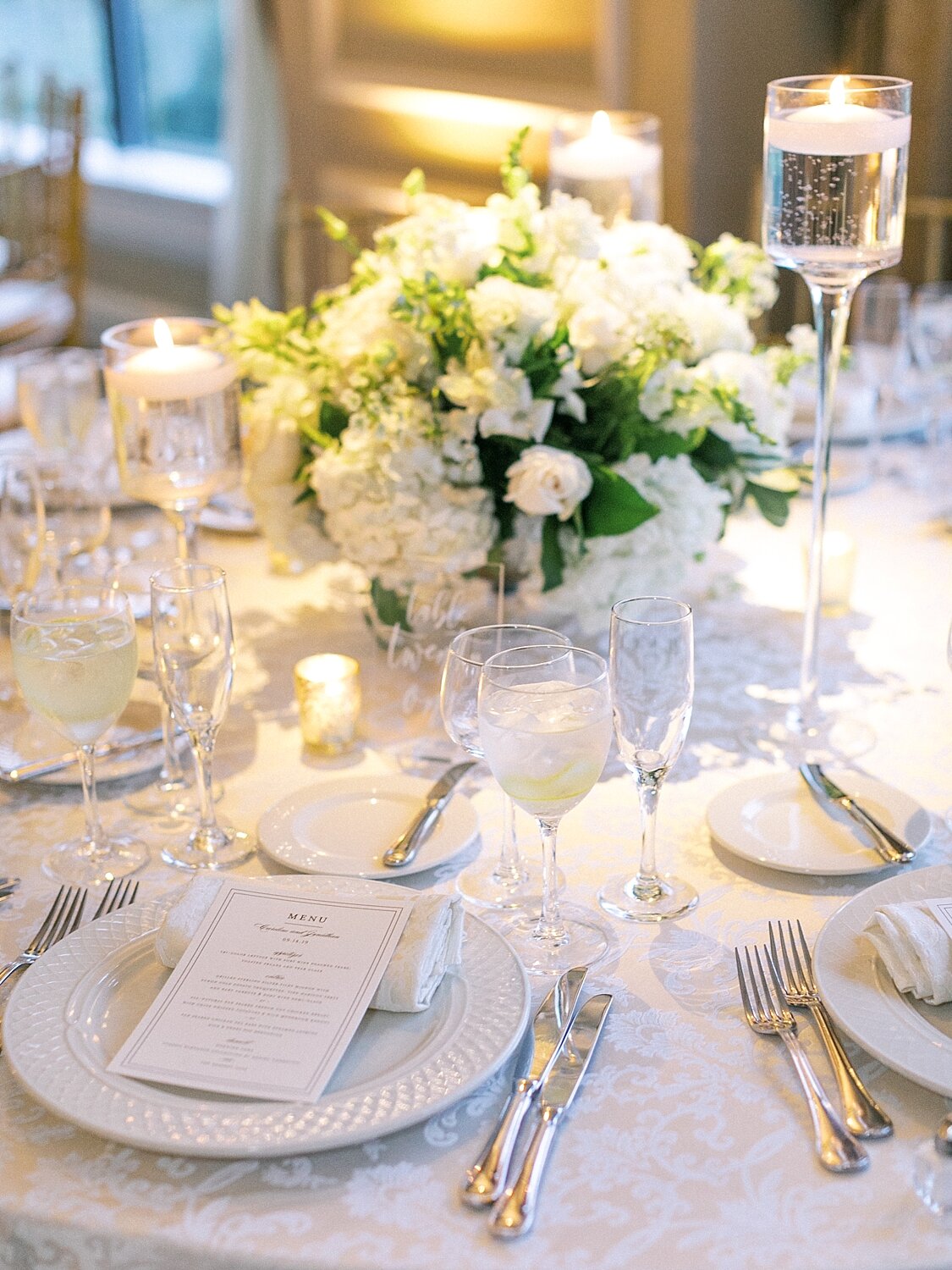 wedding reception with all white florals at Oheka Castle photographed by Asher Gardner Photography