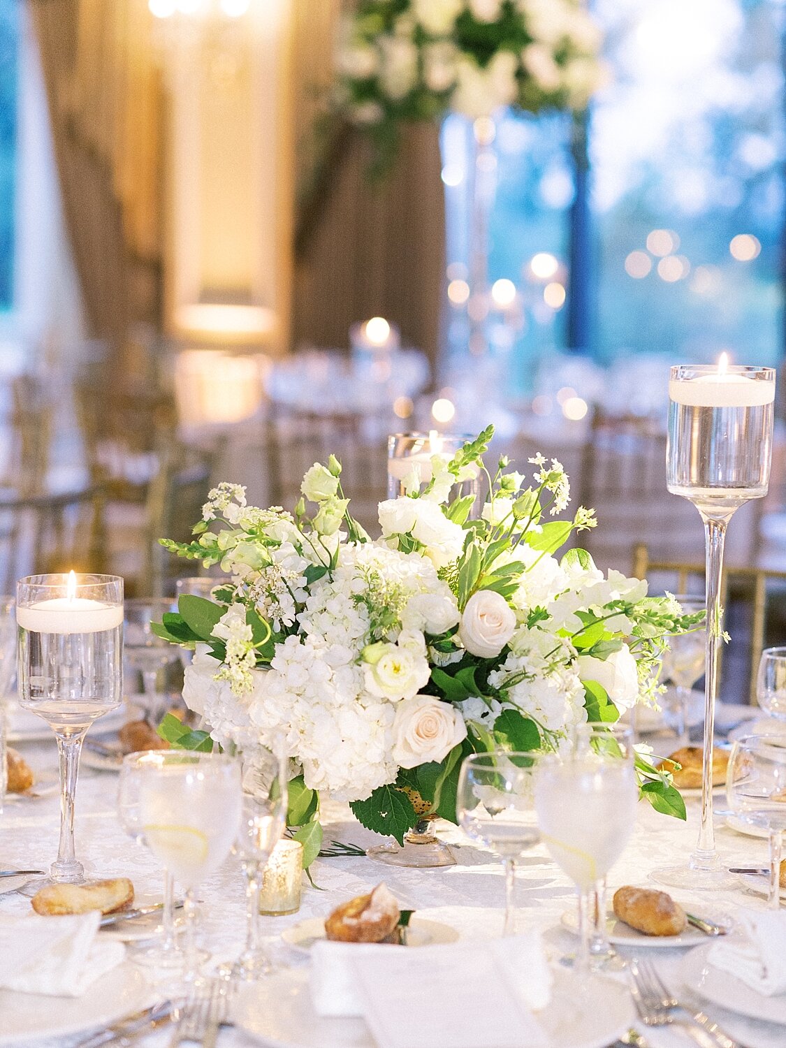 wedding reception with all white florals at Oheka Castle photographed by Asher Gardner Photography