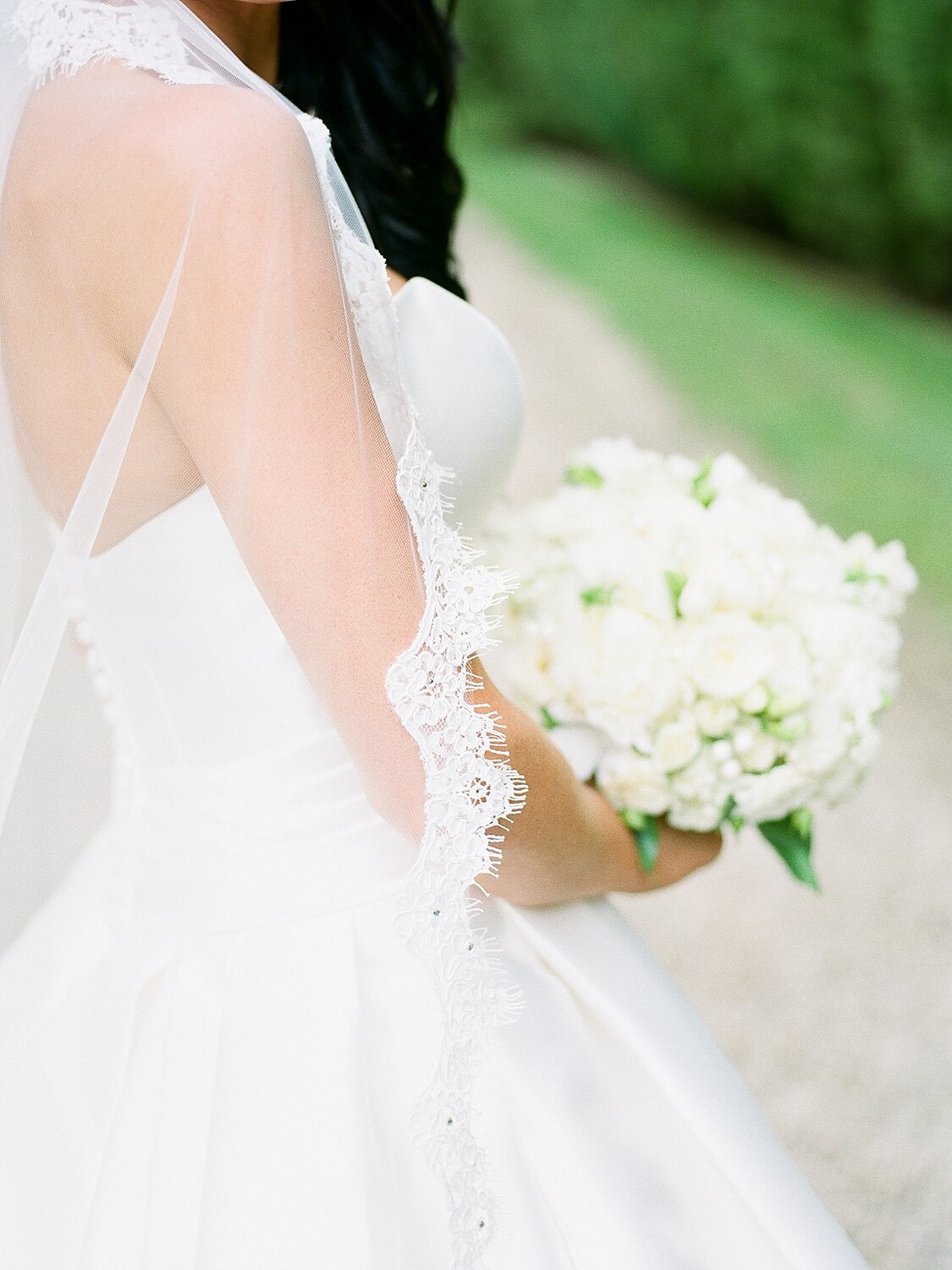 all-white wedding bouquet photographed by Asher Gardner Photography
