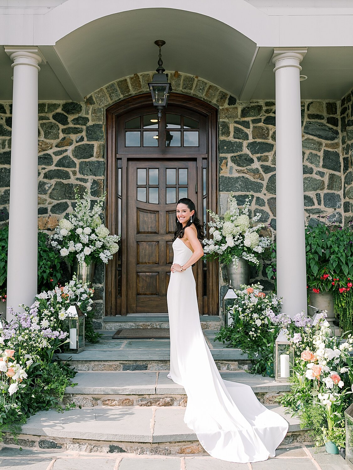 bride poses on front steps of childhood home | Stylish Private Home Wedding Inspiration | Asher Gardner Photography