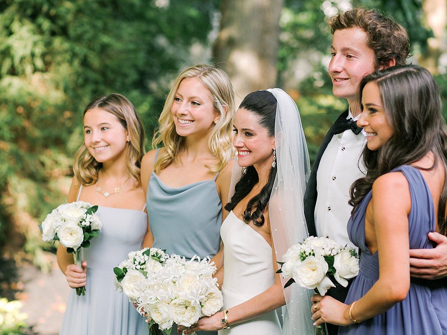 bride poses with bridesmaids on wedding morning | Stylish Private Home Wedding Inspiration | Asher Gardner Photography
