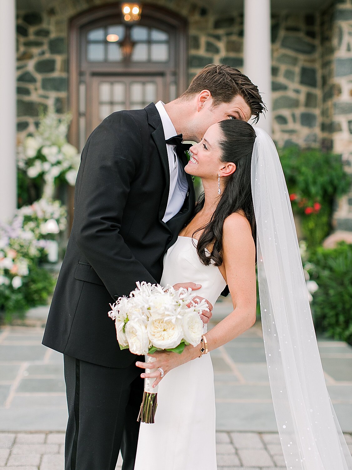 groom kisses bride on cheek | Stylish Private Home Wedding Inspiration | Asher Gardner Photography