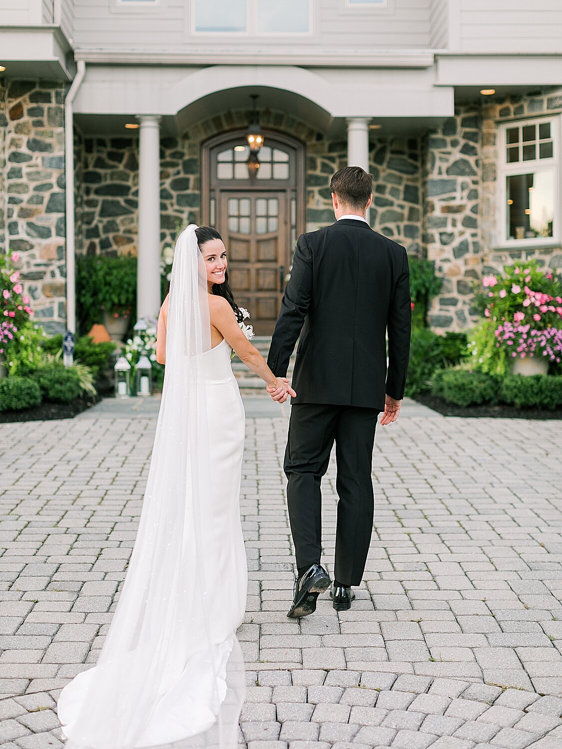 bride and groom walk towards house | Stylish Private Home Wedding Inspiration | Asher Gardner Photography