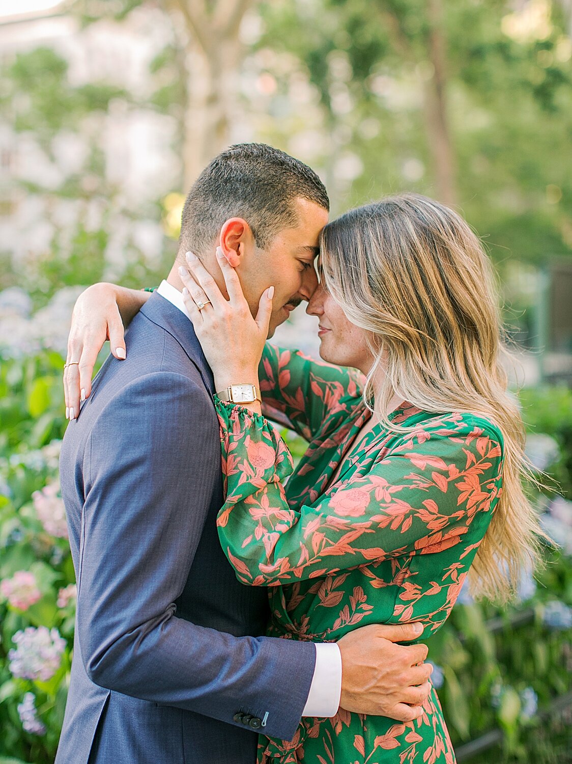 bride and groom pose in the city during engagement photos | Asher Gardner Photography | The Village engagement session