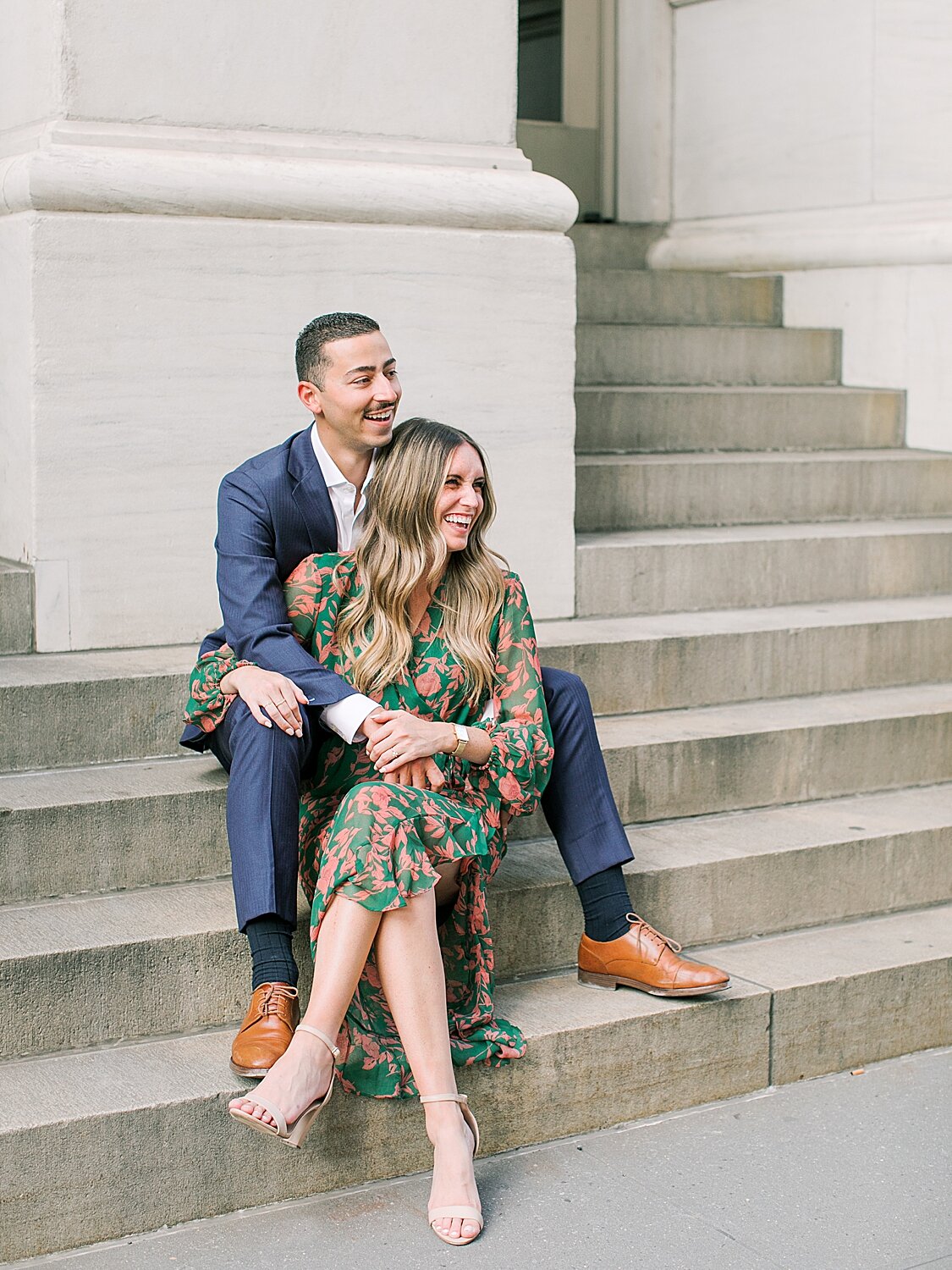 bride and groom laugh while sitting on steps | Asher Gardner Photography | The Village engagement session