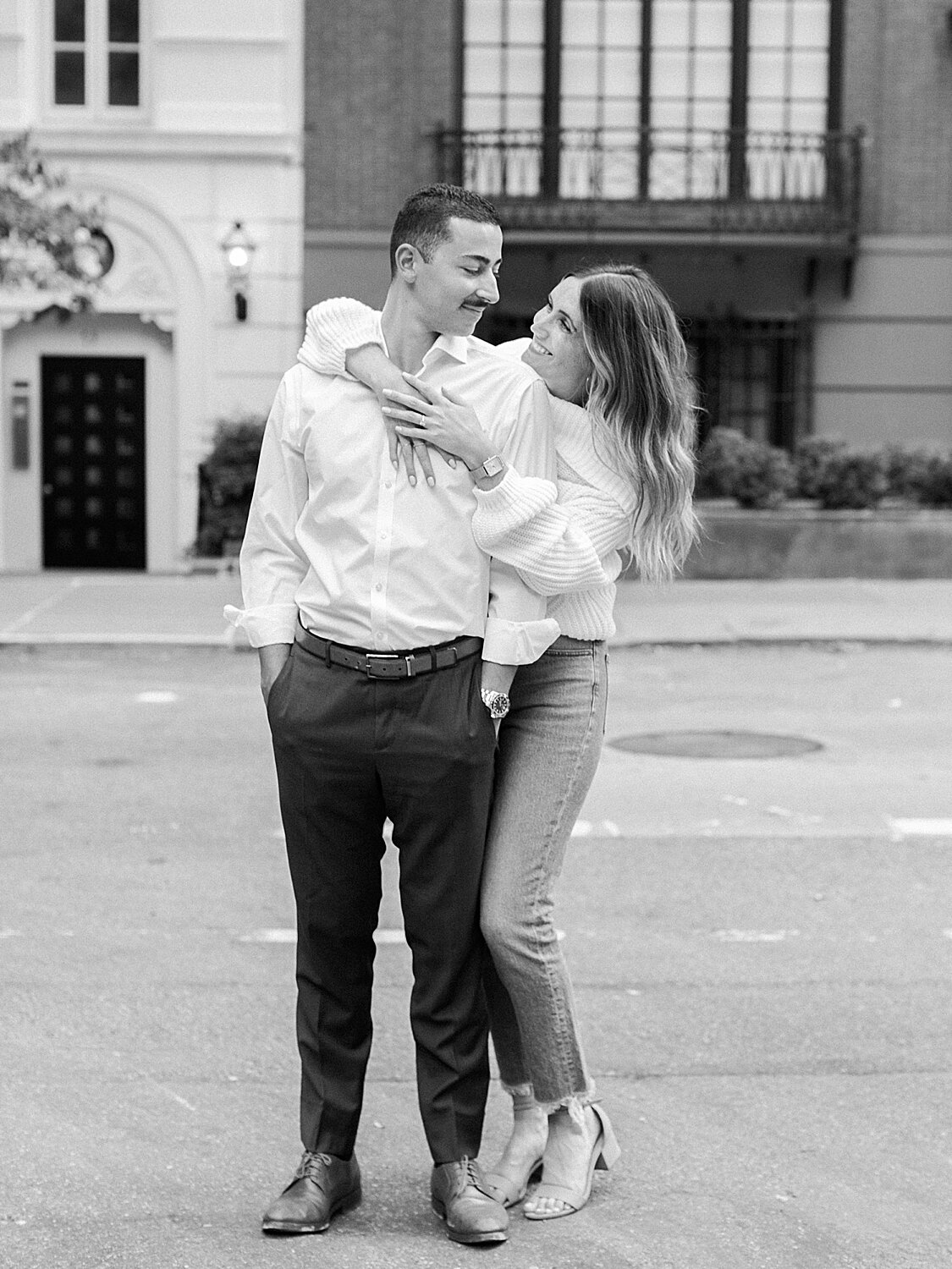 bride and groom pose in city street | Asher Gardner Photography | The Village engagement session