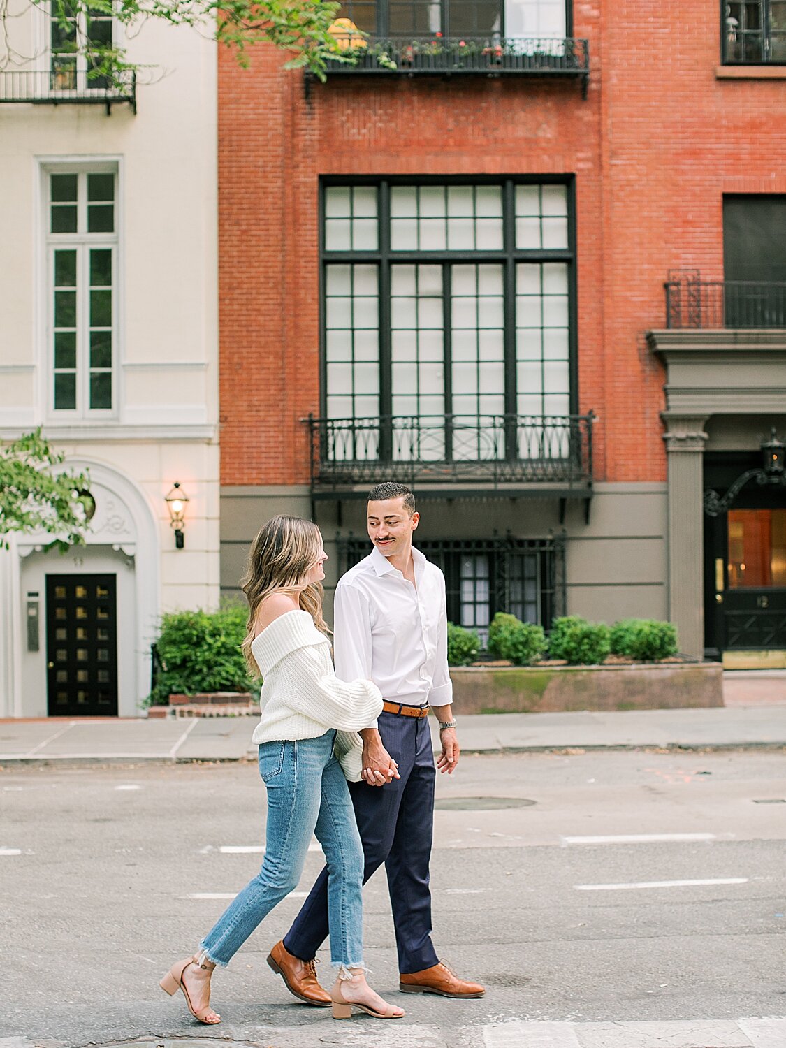 couple walks through the Village during engagement photos | Asher Gardner Photography | The Village engagement session
