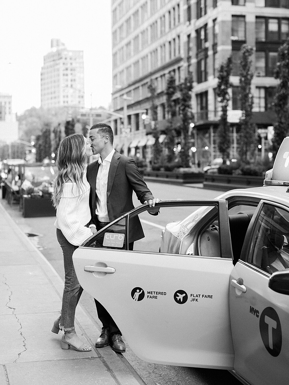 bride and groom pose by NYC taxi | Asher Gardner Photography | The Village engagement session