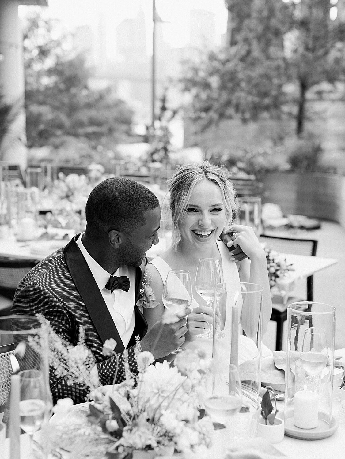 newlyweds laugh during reception at Celestine | Asher Gardner Photography | Intimate Ceremony in DUMBO New York