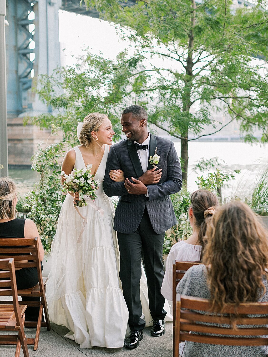 newlyweds walk up aisle in New York City | Asher Gardner Photography | Intimate Ceremony in DUMBO New York