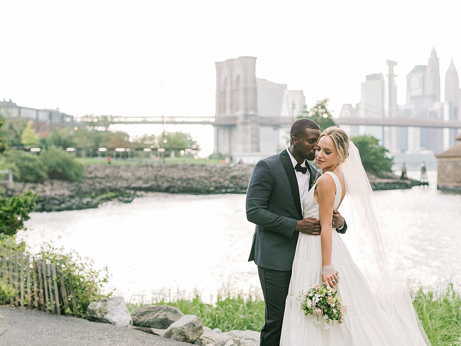 wedding portraits with Manhattan skyline | Asher Gardner Photography | Intimate Ceremony in DUMBO New York