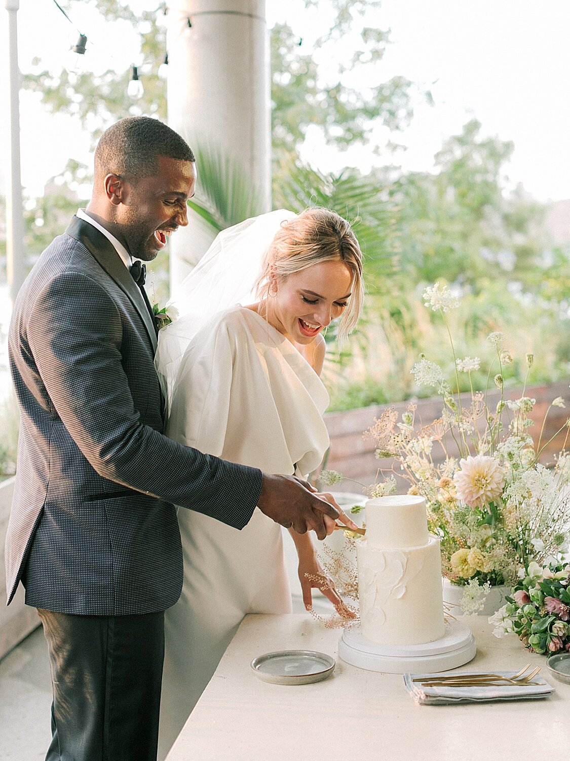 bride and groom cut wedding cake at Celestine | Asher Gardner Photography | Intimate Ceremony in DUMBO New York