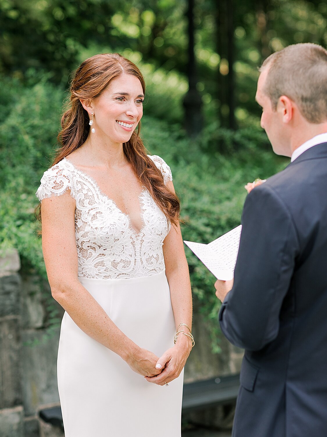 bride listens while groom reads vows | Asher Gardner Photography | Elopement at the Central Park Conservatory Gardens