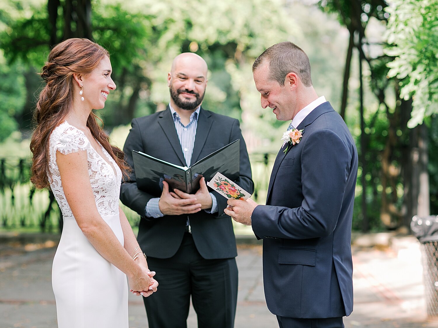 groom reads vows to bride during city elopement | Asher Gardner Photography | Elopement at the Central Park Conservatory Gardens