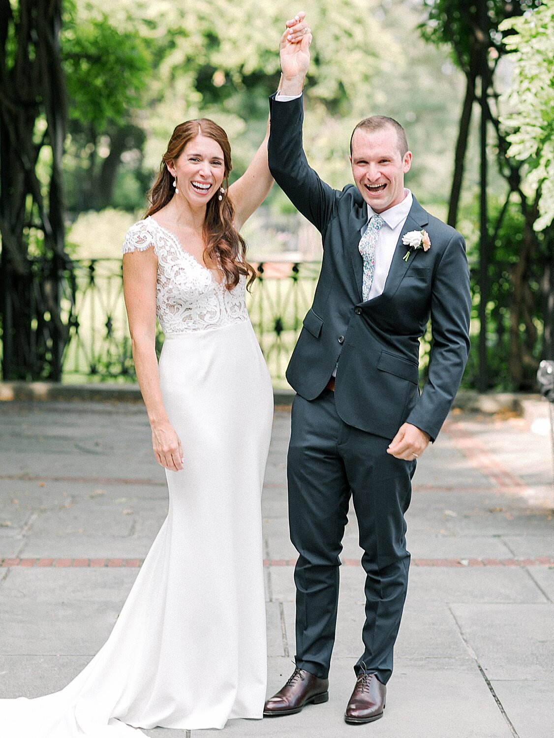 newlyweds cheer after signing marriage licnese | Asher Gardner Photography | Elopement at the Central Park Conservatory Gardens