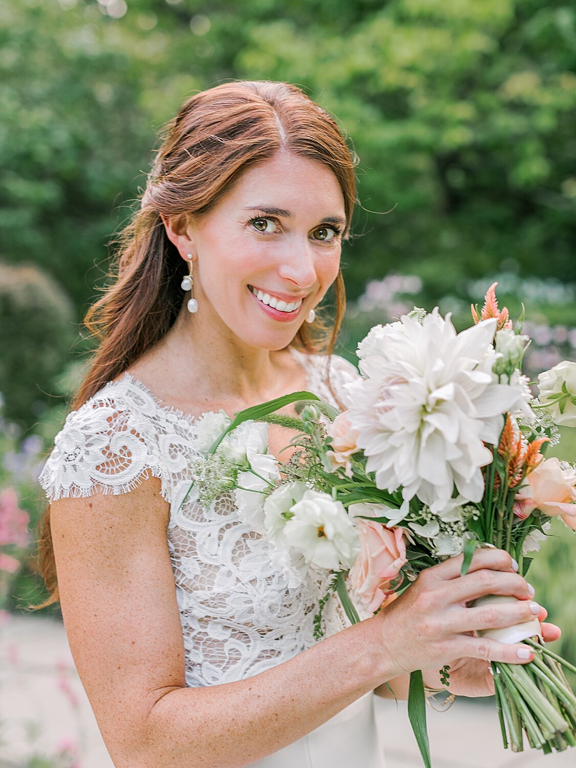 bride holds bouquet of wildflowers | Asher Gardner Photography | Elopement at the Central Park Conservatory Gardens