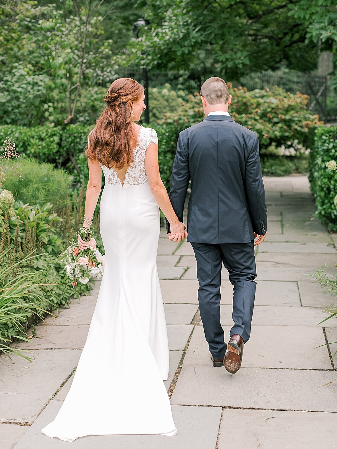 bride and groom take a walk together | Asher Gardner Photography | Elopement at the Central Park Conservatory Gardens