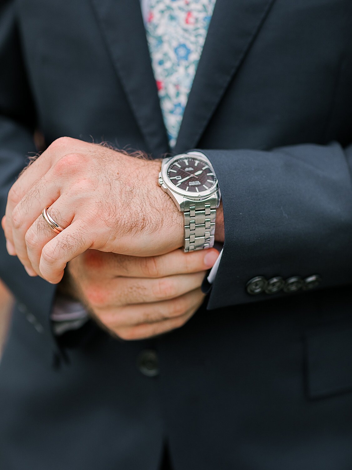 groom adjusts watch before NY wedding day | Asher Gardner Photography | Elopement at the Central Park Conservatory Gardens