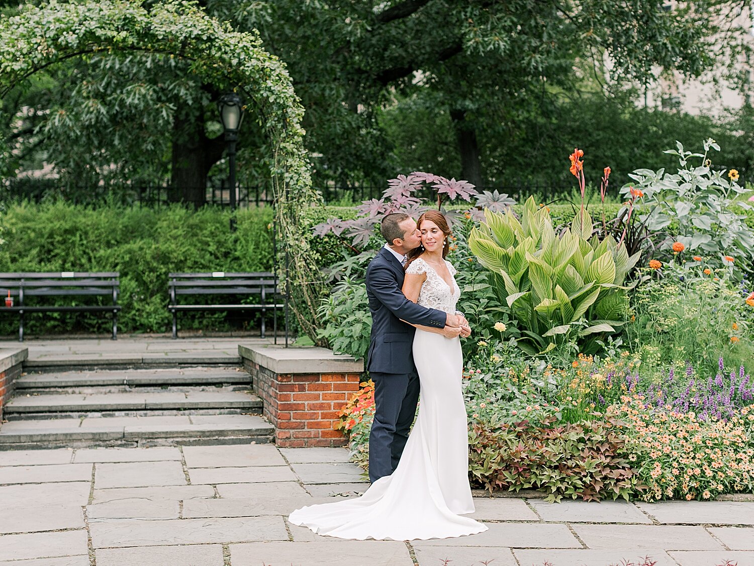 groom hugs bride during wedding photos in NYC | Asher Gardner Photography | Elopement at the Central Park Conservatory Gardens