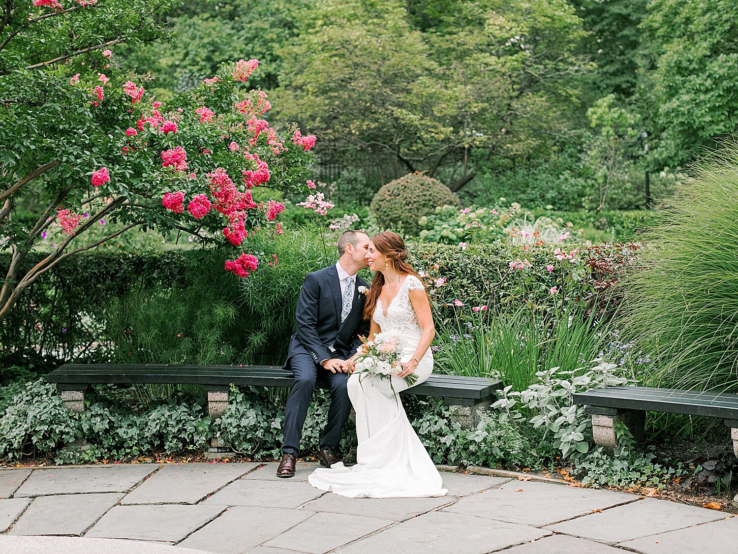bride and groom sit on bench in Central Park | Asher Gardner Photography | Elopement at the Central Park Conservatory Gardens