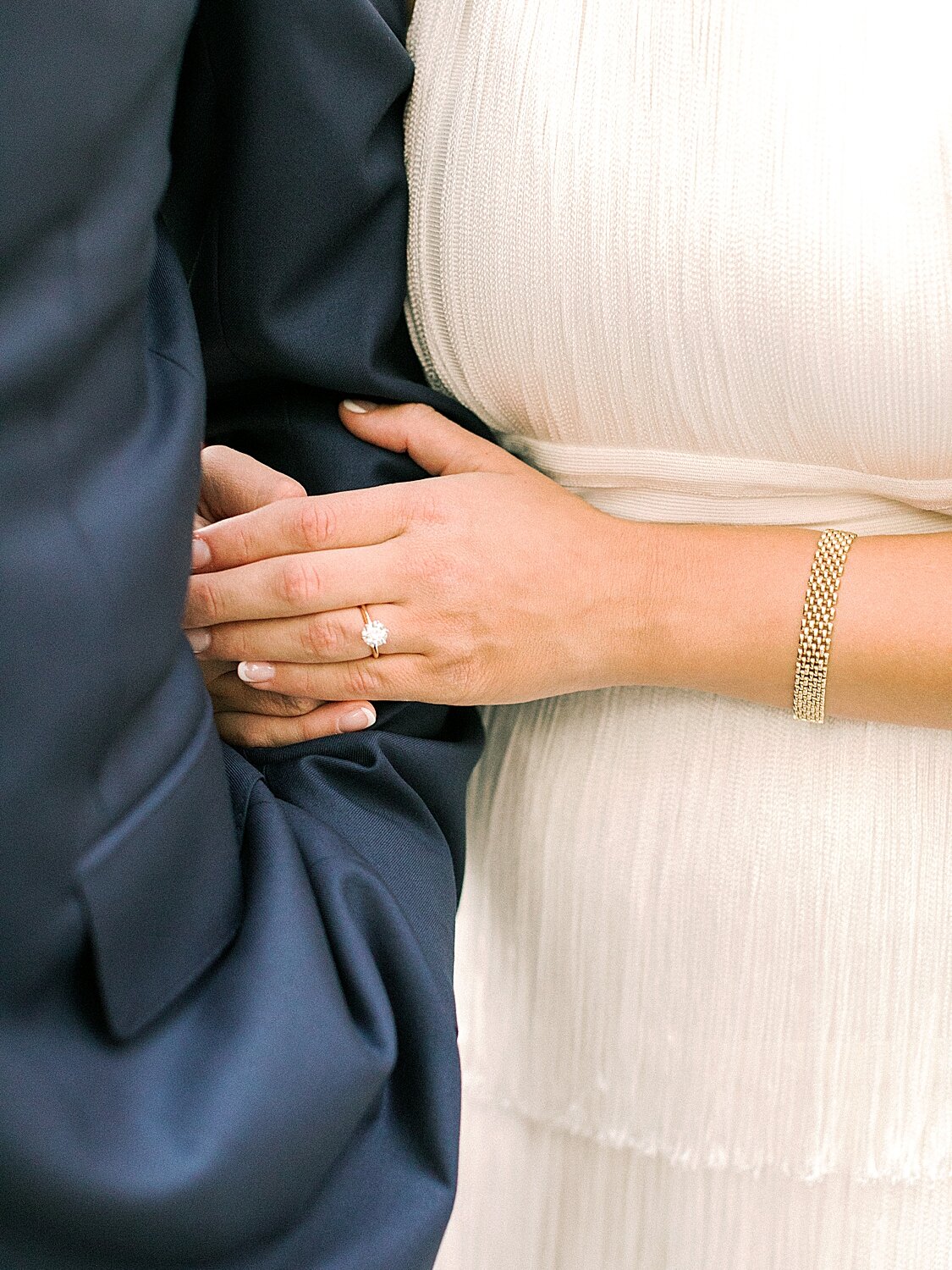 bride shows off engagement ring while holding onto groom | Asher Gardner Photography | Gramercy Park Engagement Session
